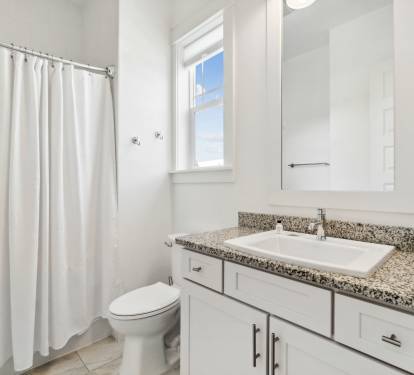 Bunk Room En Suite Equipped with a Tub Shower Combo & Single Vanity