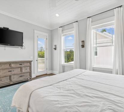 Primary King Suite - Equipped with a Flat-Screen TV & Balcony Access