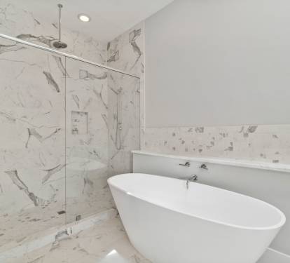 Enjoy the Walk-In Shower or Soaking Tub in the Primary En-Suite