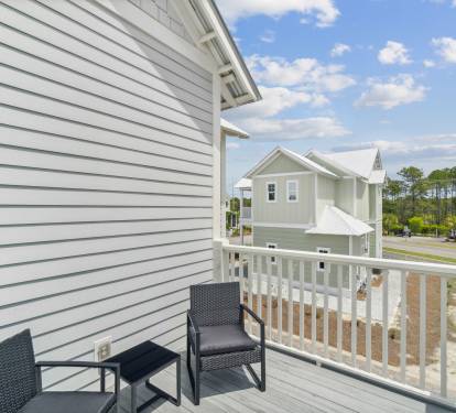 2nd Floor Primary Suite Balcony Offering Seating for Two
