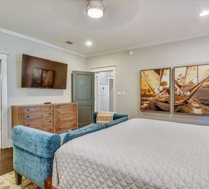 1st Floor Primary Suite - Equipped with a Large Flat Screen TV