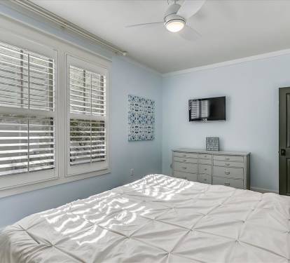 1st Floor Primary Suite - Equipped with a Flat Screen TV