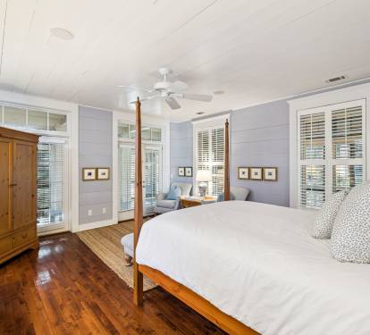 Primary Suite - Offering a Flat-Screen TV & Porch Access