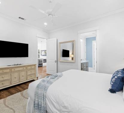 1st Floor Primary Suite - Equipped with a Large Flat Screen TV