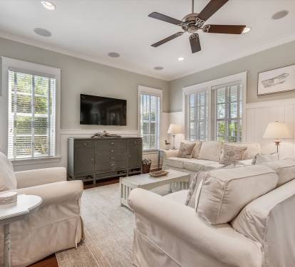 Plush seating, large TV, and seamless flow to the porch for relaxed family time.