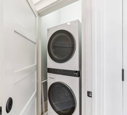 Stack Washer & Dryer Located in the Laundry Area