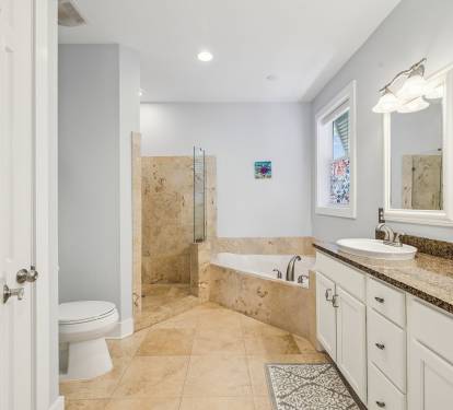 Primary King En-Suite - Oversized Soaking Tub + Walk-In Shower