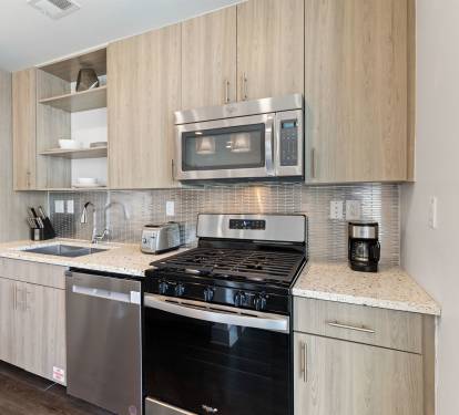 Well Equipped Kitchen with Stainless Steel Appliances