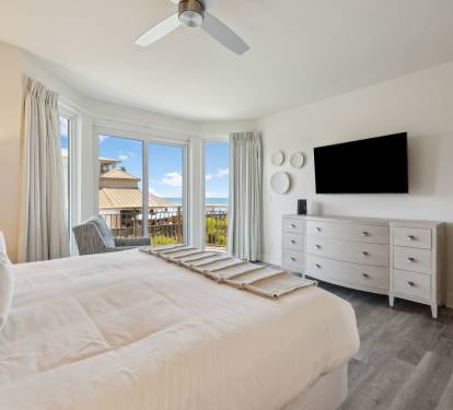 Primary King Suite - Balcony Access & a Flat-Screen TV