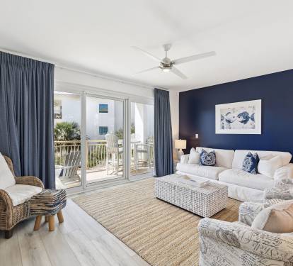 Relax in the Cozy Living Area - Offering Wall to Wall Pool & Gulf Views!