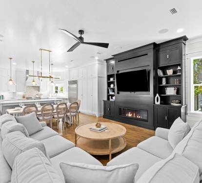 Bright, open gathering space with sectional seating and indoor-outdoor flow.