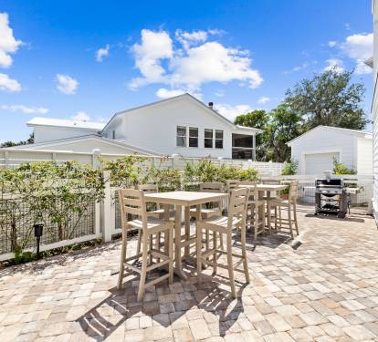 Enjoy al fresco meals with a gas grill and patio TV.