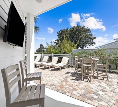 Watch the game or enjoy movie nights by the pool.