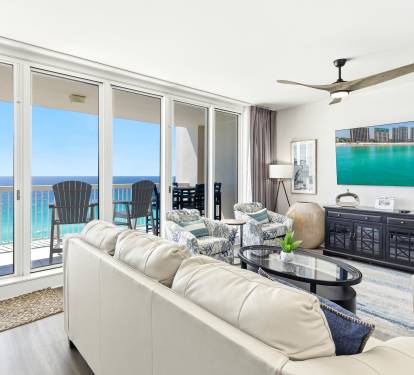 Unwind in your elegant oceanfront living room with stunning turquoise views stretching to the horizon.