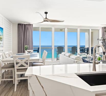 Step into your bright oceanfront sanctuary where every window frames endless turquoise waters and your morning coffee comes with breathtaking sea views.