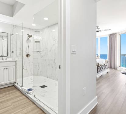 Unwind in your luxurious marble shower after beach days, with stunning ocean views beckoning from your private bedroom sanctuary.