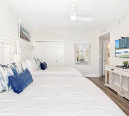 Unwind in your coastal bedroom where twin beds offer comfort and beachy decor creates serenity. Watch TV or admire artwork in this bright, airy retreat.