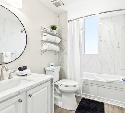 Unwind in your marble-appointed bathroom with luxurious soaking tub and modern amenities.