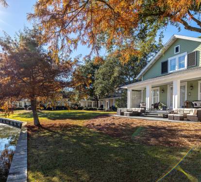 Waterfront property with autumn foliage and spacious outdoor areas perfect for seasonal retreats.