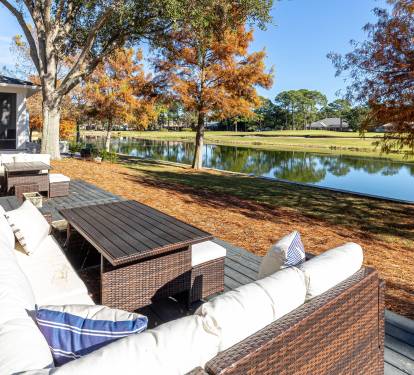 Scenic waterfront deck with autumn foliage and peaceful lake views creating a tranquil retreat.