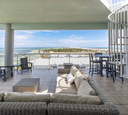 Unwind on your spacious waterfront terrace with plush seating and sweeping views—perfect for morning coffee or evening relaxation.