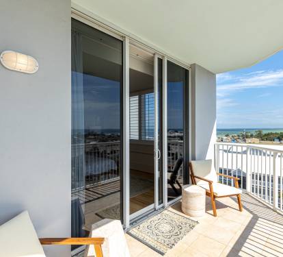 Step onto your private balcony with stylish seating, where you'll soak up coastal views and gentle ocean breezes through your sliding glass doors.