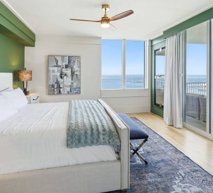 Wake up to breathtaking ocean views in your serene bedroom, where crisp white linens and coastal breezes create the perfect retreat.
