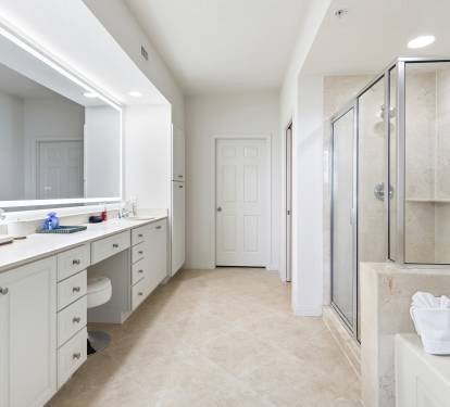 Indulge in your spacious master suite with dual vanities, walk-in shower, and soaking tub—perfect for unwinding after exploring.