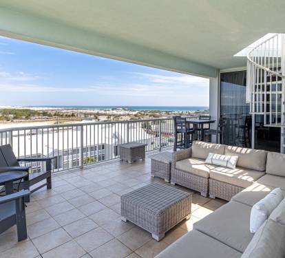 Unwind on your private balcony with plush outdoor seating as you soak in stunning coastal views stretching to the horizon.