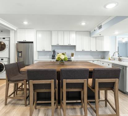 Cook and gather around your spacious kitchen island with modern appliances and convenient laundry access.