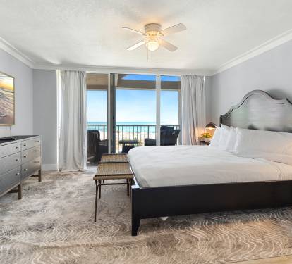 Wake up to stunning ocean views from your comfortable king bed, with direct balcony access to watch sunrise over the waves.