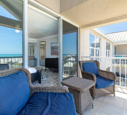 Sink into plush wicker seating on your private balcony, where ocean breezes and stunning sea views create the perfect morning coffee spot.