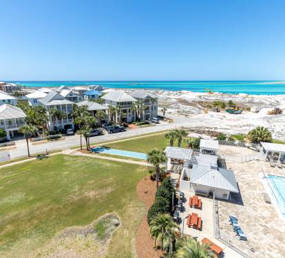Stunning beachfront community with pristine white sand beaches and crystal-clear turquoise waters just steps from elegant coastal homes.