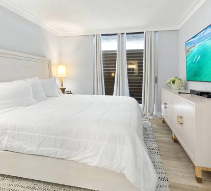 Drift into restful sleep in your serene bedroom with crisp linens and coastal artwork creating the perfect retreat.