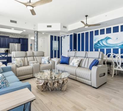 Unwind in this stunning coastal living space where ocean-inspired blues meet modern comfort, perfect for your beach getaway relaxation.