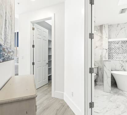 Step into your luxurious marble bathroom retreat, where elegant tile work and a stunning soaking tub create the perfect space to unwind.