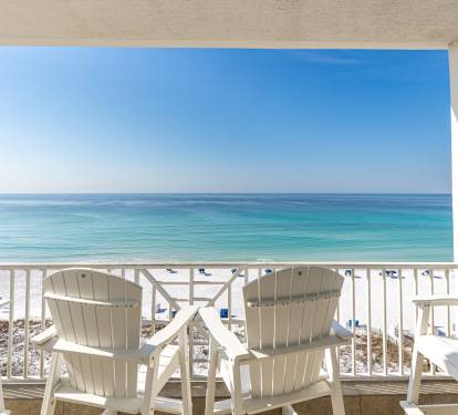 Breathe in the salt air from your private balcony, where turquoise waters stretch endlessly before you.