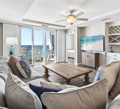 Unwind in your coastal sanctuary where soft neutral tones meet ocean breezes through open doors to your private balcony.