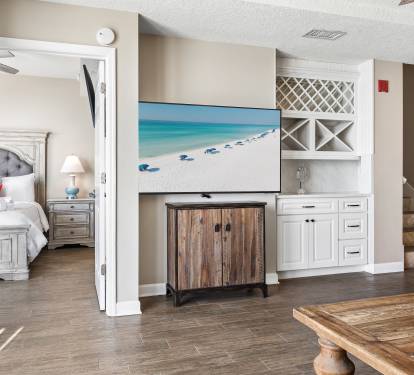 Your spacious living area flows seamlessly into your private bedroom, featuring custom built-ins and coastal vibes for ultimate relaxation.