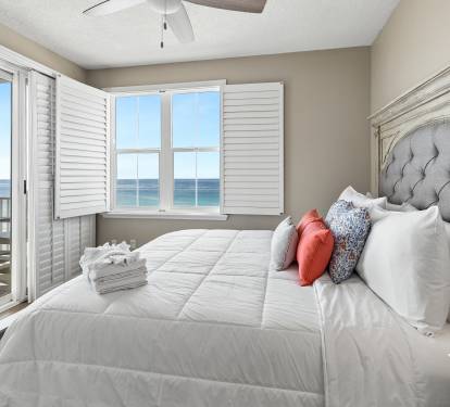 Wake up to ocean waves and crisp sea air from your plush king bed with direct balcony access to stunning water views.