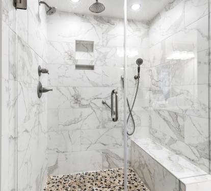 Step into your luxurious marble shower sanctuary with rainfall head, built-in bench, and spa-like finishes for ultimate relaxation.
