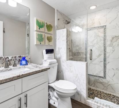 Unwind in your elegant marble bathroom with walk-in shower and granite vanity—your personal spa retreat.