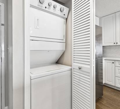 Your private washer and dryer tucked away in sleek white cabinetry means fresh clothes throughout your stay.