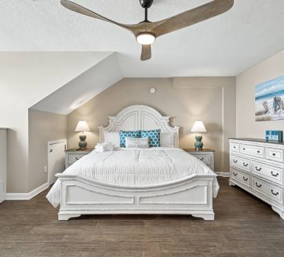 Drift off peacefully in your coastal-inspired retreat, complete with elegant white furnishings and soothing beach artwork that brings ocean tranquility indoors.