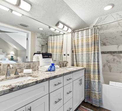 Unwind in your elegant marble bathroom featuring dual vanities, granite counters, and a relaxing tub-shower combo.
