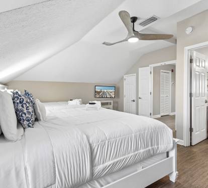 Cozy under vaulted ceilings, your peaceful retreat features crisp linens and thoughtful touches for restful nights.