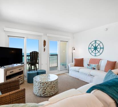 Relax in this bright coastal living room with gulf views, cozy seating, and nautical touches that make you feel right at home.