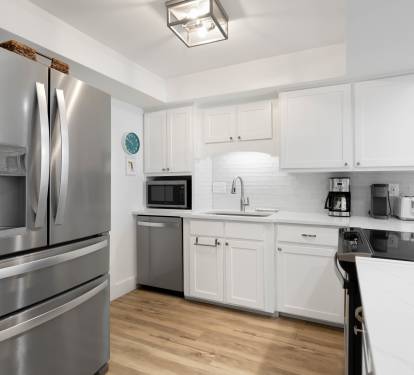 Cook effortlessly in your fully equipped kitchen with stainless steel appliances, granite counters, and everything you need for memorable meals.