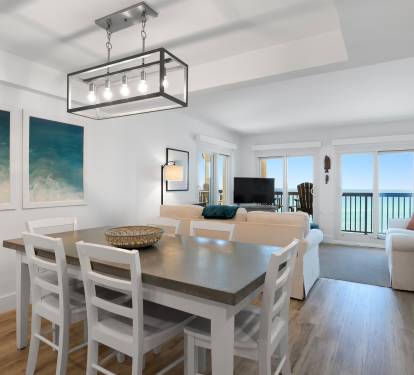 Relax in your bright, coastal-inspired living space where ocean views frame every meal and the open layout flows from dining to sea.