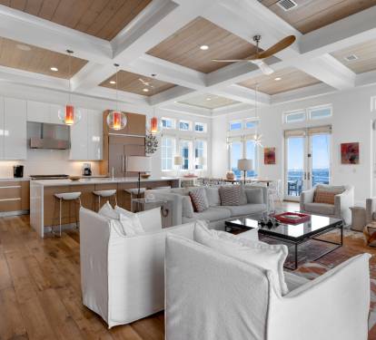 Relax in this stunning open-concept space where modern luxury meets coastal charm, with gulf views streaming through floor-to-ceiling windows.